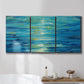 Three-panel canvas wall art featuring deep blue ocean water abstraction, displayed in a bathroom above a bathtub.