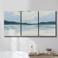 Three-panel canvas wall art featuring soft coastal shoreline landscape, displayed in a bathroom above a bathtub.