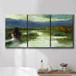 Three-panel canvas wall art featuring open meadow landscape with distant hills, displayed in a bathroom above a bathtub.