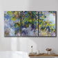 Three-panel canvas wall art featuring cascading purple wisteria blooms, displayed in a bathroom above a bathtub.