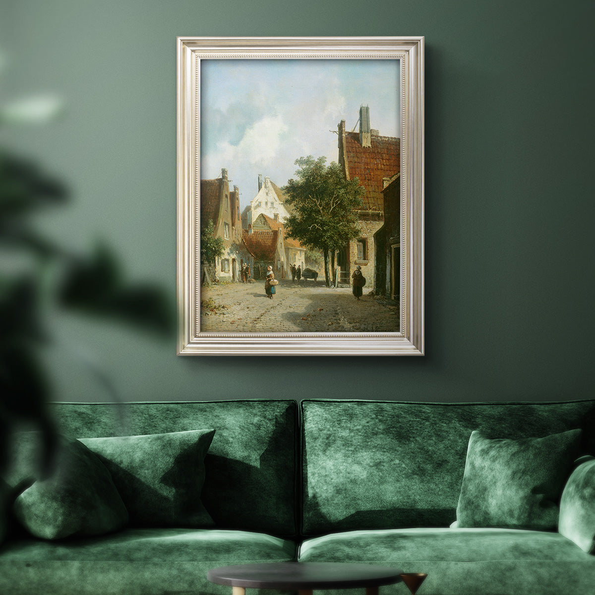 Rustic European street scene painting by Adriaan Eversen in an ornate champagne frame displayed in a dark-toned interior setting.