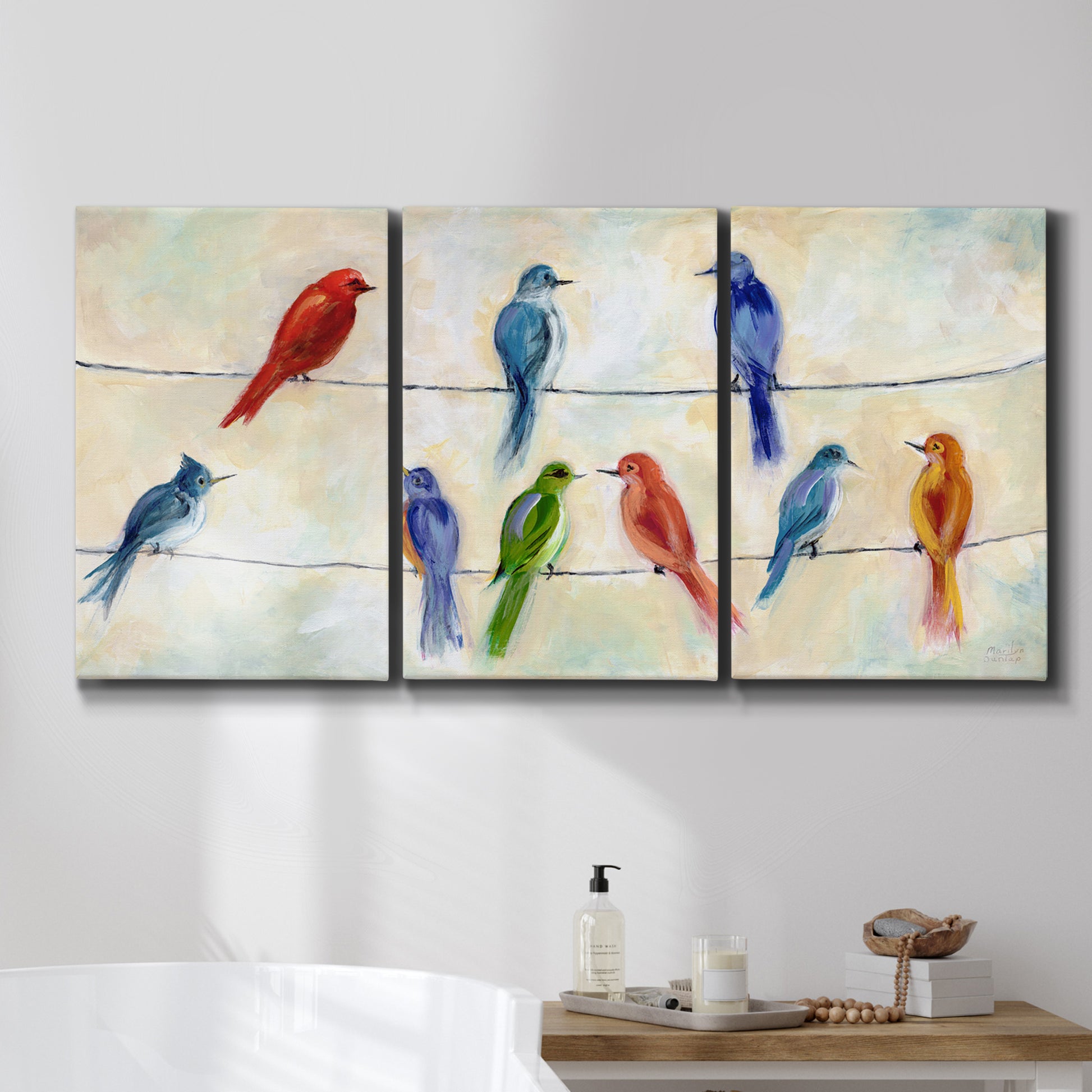 Three-panel canvas wall art featuring whimsical animal chatter illustration, displayed in a bathroom above a bathtub.