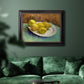 Impressionist still life with lemons by Vincent van Gogh in an ornate black frame with gilded inner detail displayed in a dark-toned interior setting.