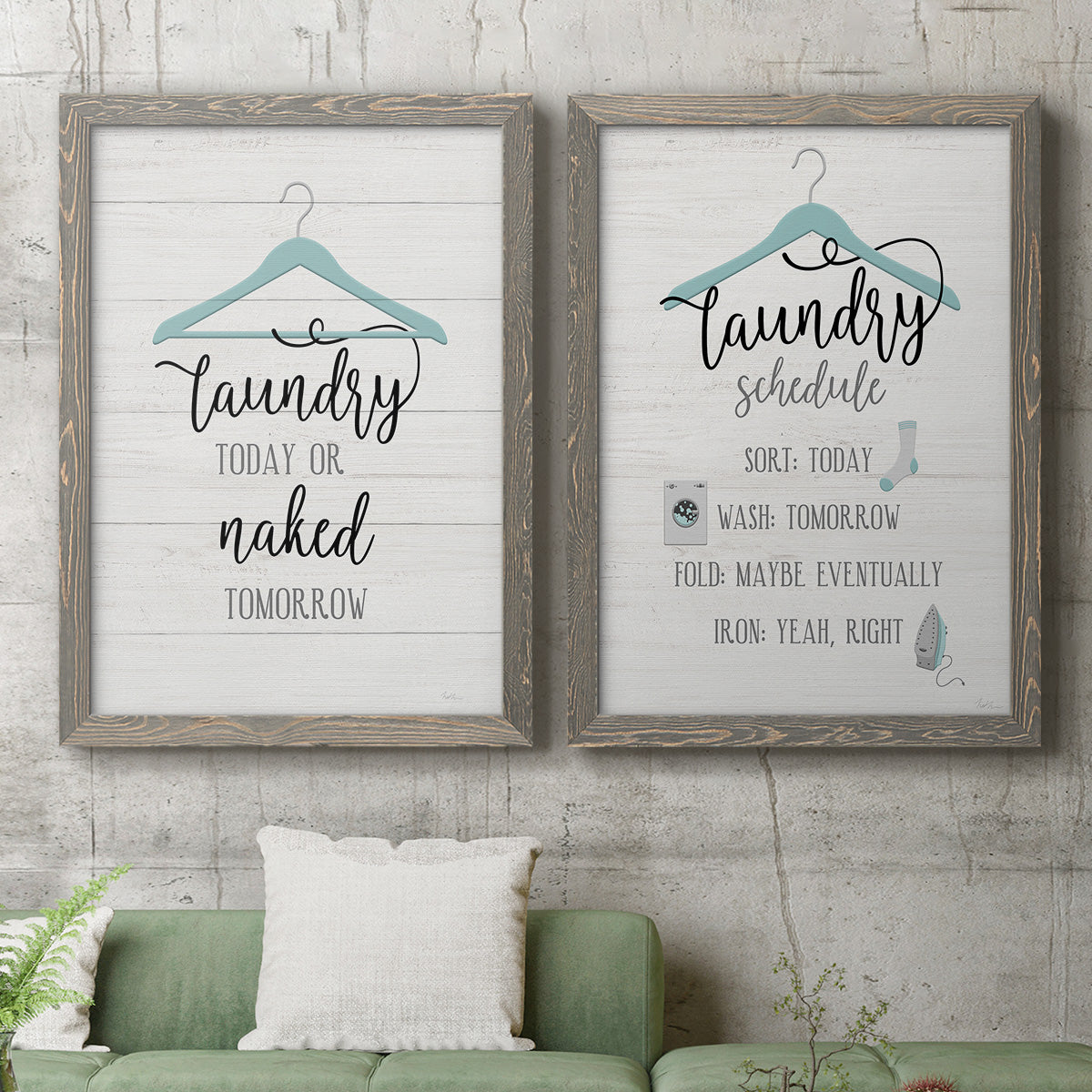 Set of two gray barnwood framed canvas prints depicting a coordinated art pair of humorous laundry-room sayings and clothing icons rendered as rustic typographic wall art above a sofa in a modern living room.