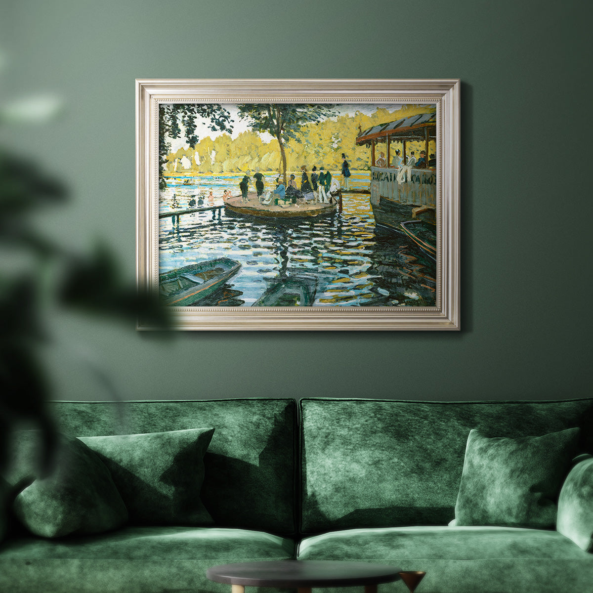 Impressionist riverside leisure scene by Claude Monet in an ornate champagne frame displayed in a dark-toned interior setting.