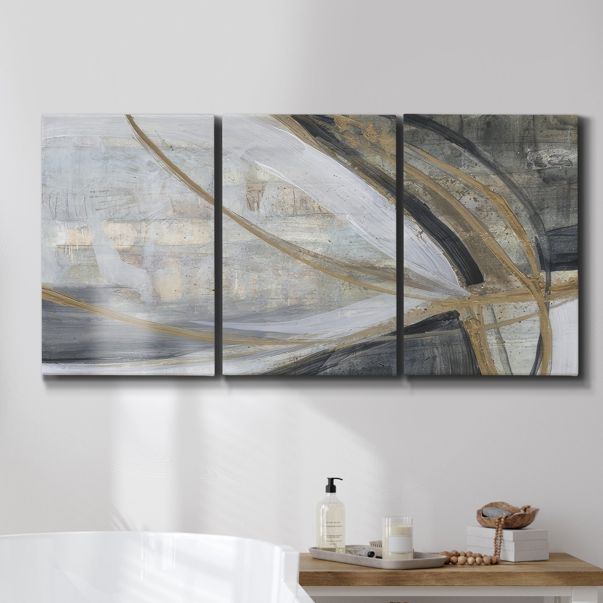 Three-panel canvas wall art featuring spiraling abstract vortex motion, displayed in a bathroom above a bathtub.