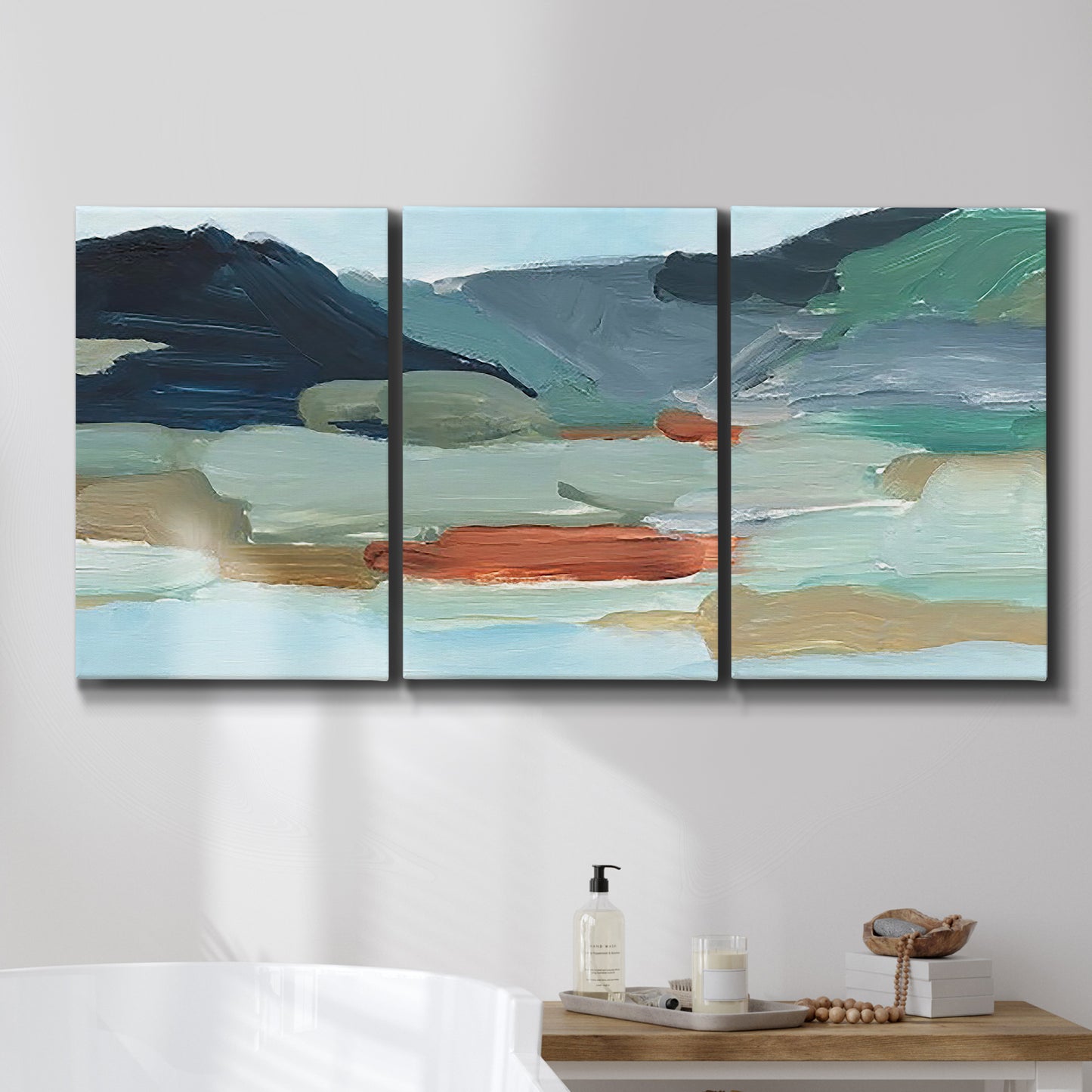 Three-panel canvas wall art featuring vibrant abstract with dramatic motion, displayed in a bathroom above a bathtub.