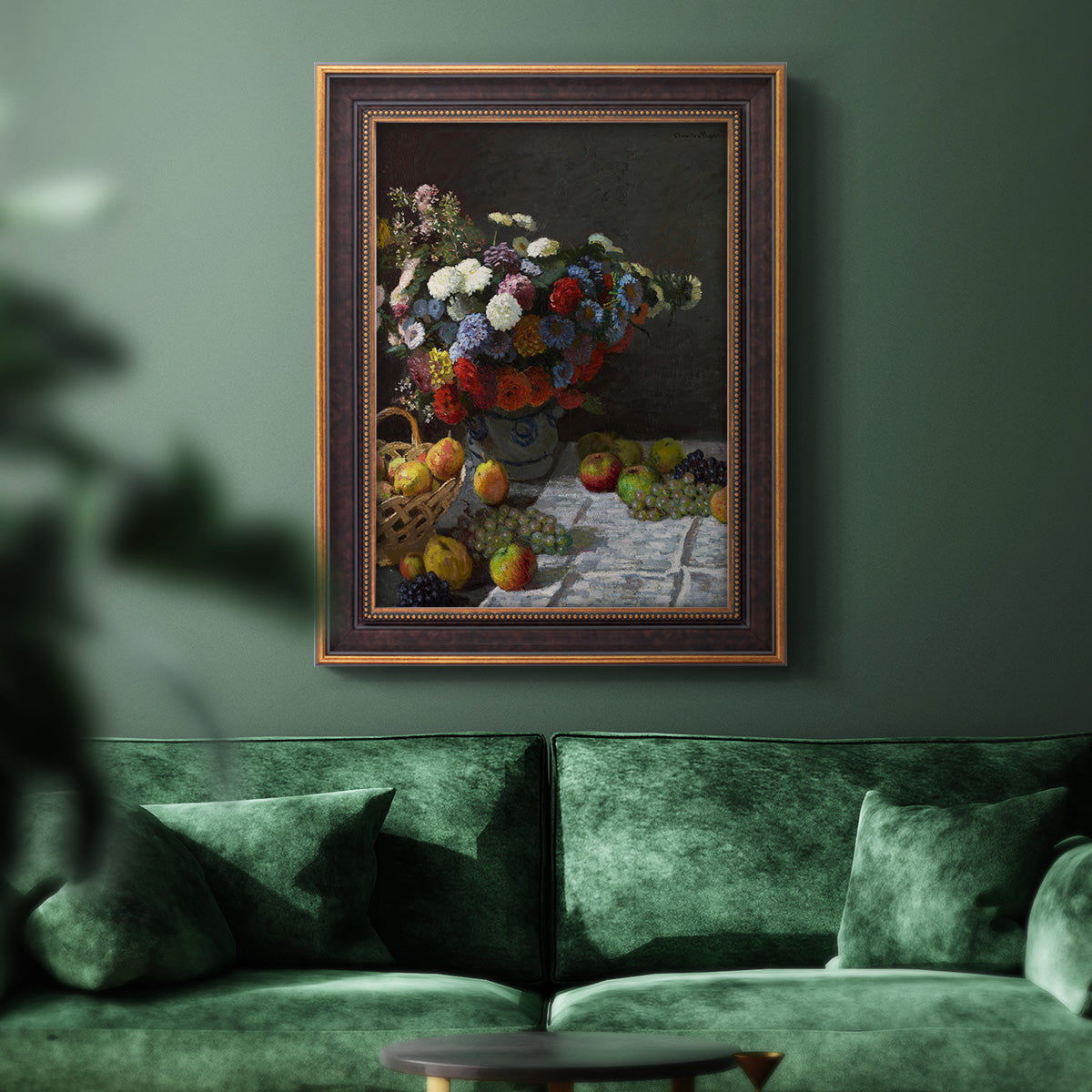 Impressionist floral still life painting by Claude Monet in an ornate bronzed mahogany wood frame displayed in a dark-toned interior setting.