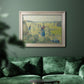 Impressionist rural hay harvest landscape by Camille Pissarro in an ornate champagne frame displayed in a dark-toned interior setting.