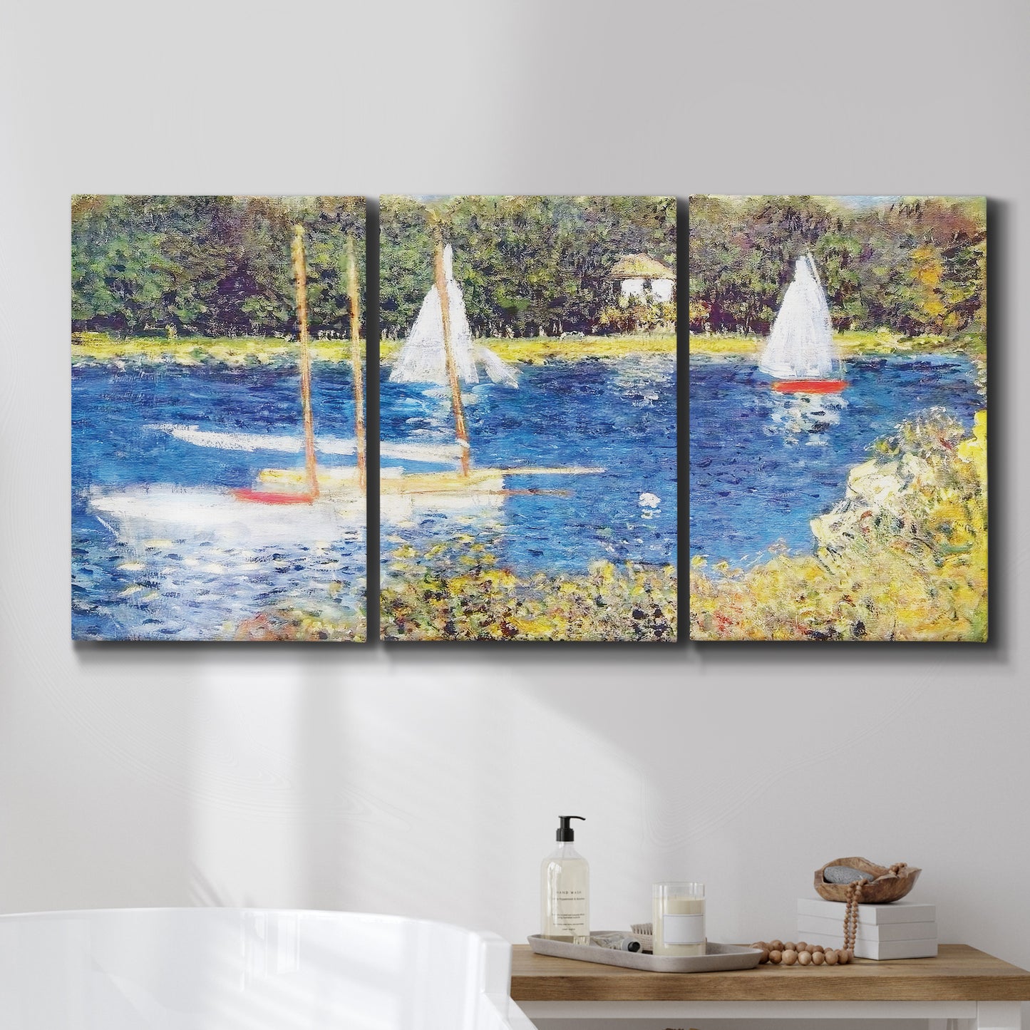 Three-panel canvas wall art featuring river scene with reflections, displayed in a bathroom above a bathtub.