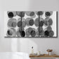Three-panel canvas wall art featuring geometric abstract watercolor forms, displayed in a bathroom above a bathtub.