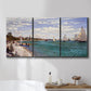 Three-panel canvas wall art featuring river basin with boats, displayed in a bathroom above a bathtub.