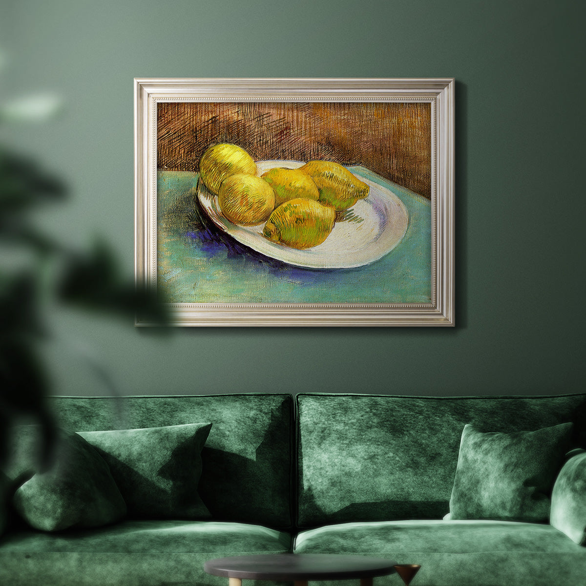 Impressionist still life with lemons by Vincent van Gogh in an ornate champagne frame displayed in a dark-toned interior setting.