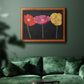 Contemporary poppy flower artwork in an ornate vintage burl wood frame displayed in a dark-toned interior setting.