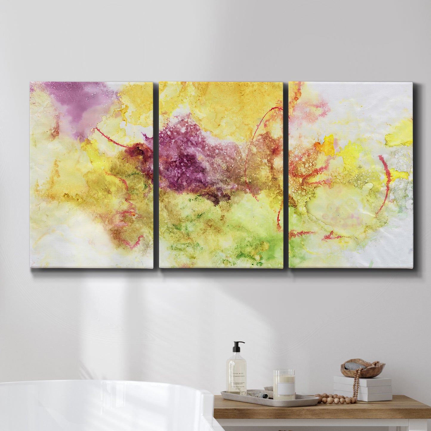 Three-panel canvas wall art featuring abstract floral rhythm composition, displayed in a bathroom above a bathtub.