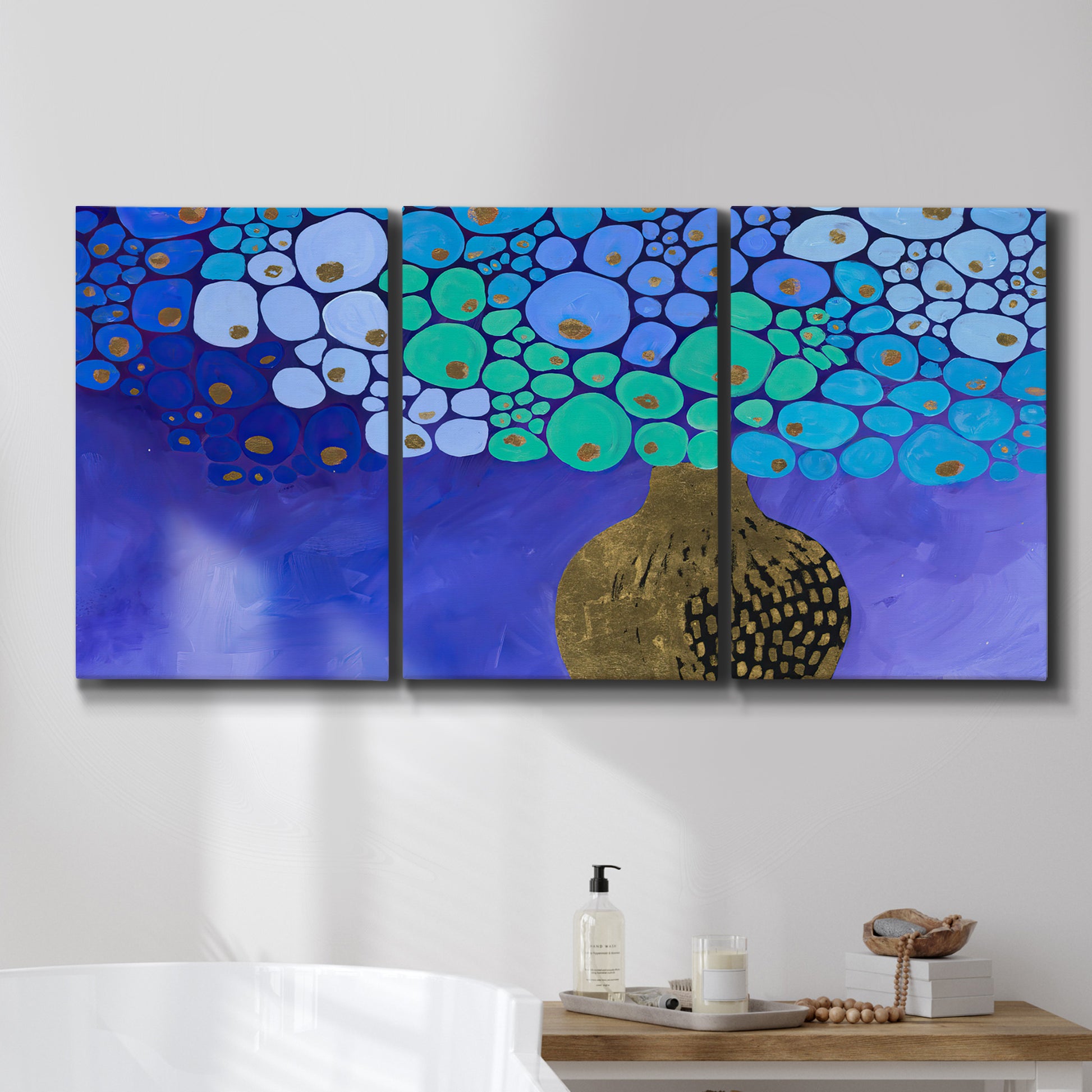 Three-panel canvas wall art featuring blue poppy floral abstraction, displayed in a bathroom above a bathtub.