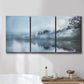 Three-panel canvas wall art featuring calm waters at sunrise photograph, displayed in a bathroom above a bathtub.