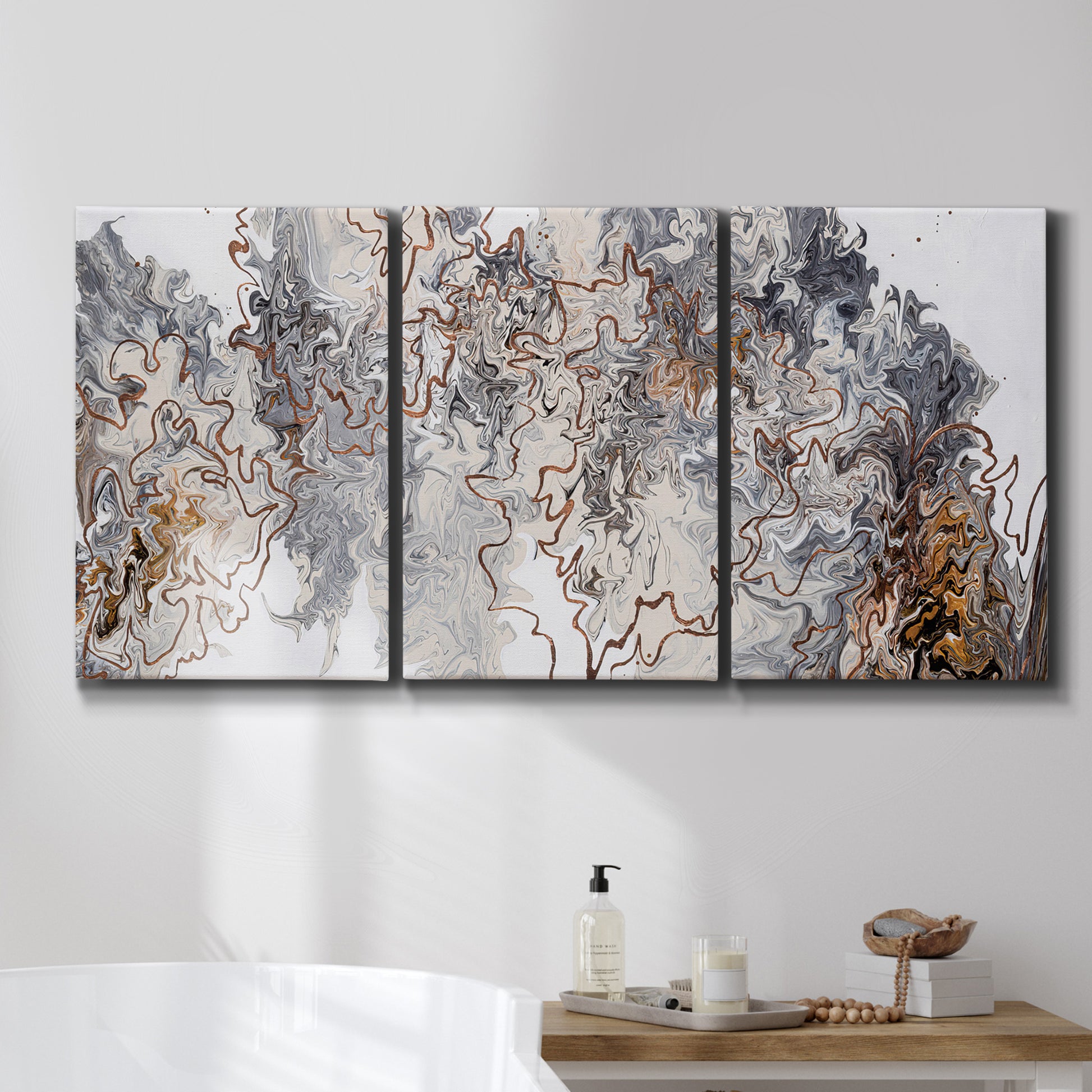 Three-panel canvas wall art featuring wooded trail through forest, displayed in a bathroom above a bathtub.