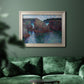 Impressionist rocky seascape by Claude Monet in an ornate champagne frame displayed in a dark-toned interior setting.