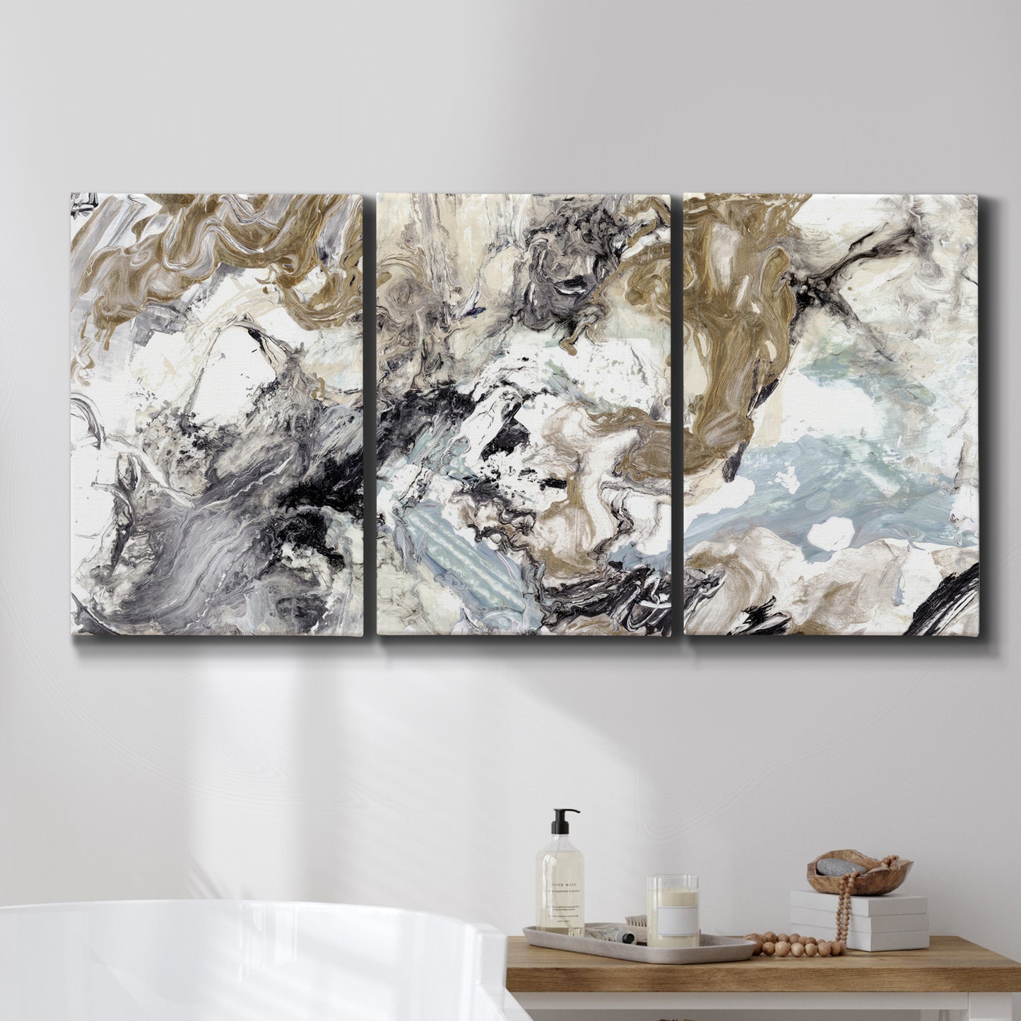 Three-panel canvas wall art featuring marbled modern abstract textures, displayed in a bathroom above a bathtub.