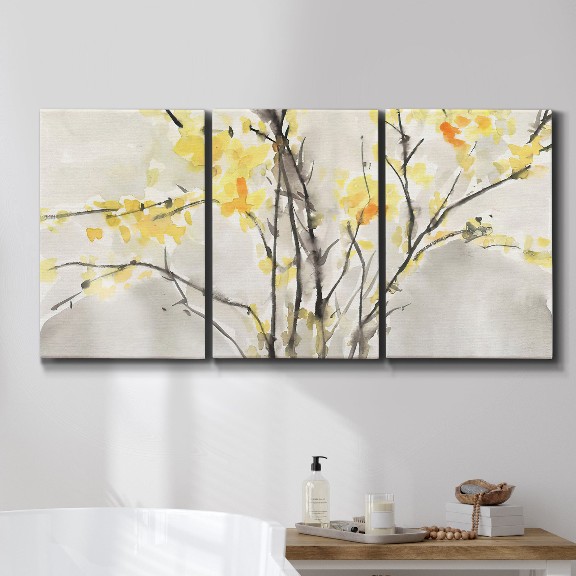 Three-panel canvas wall art featuring soft floral abstract harmony, displayed in a bathroom above a bathtub.