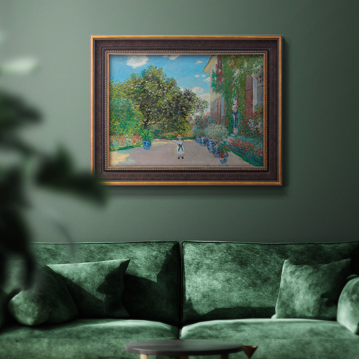 Impressionist residential landscape at Argenteuil by Claude Monet in an ornate bronzed mahogany wood frame displayed in a dark-toned interior setting.