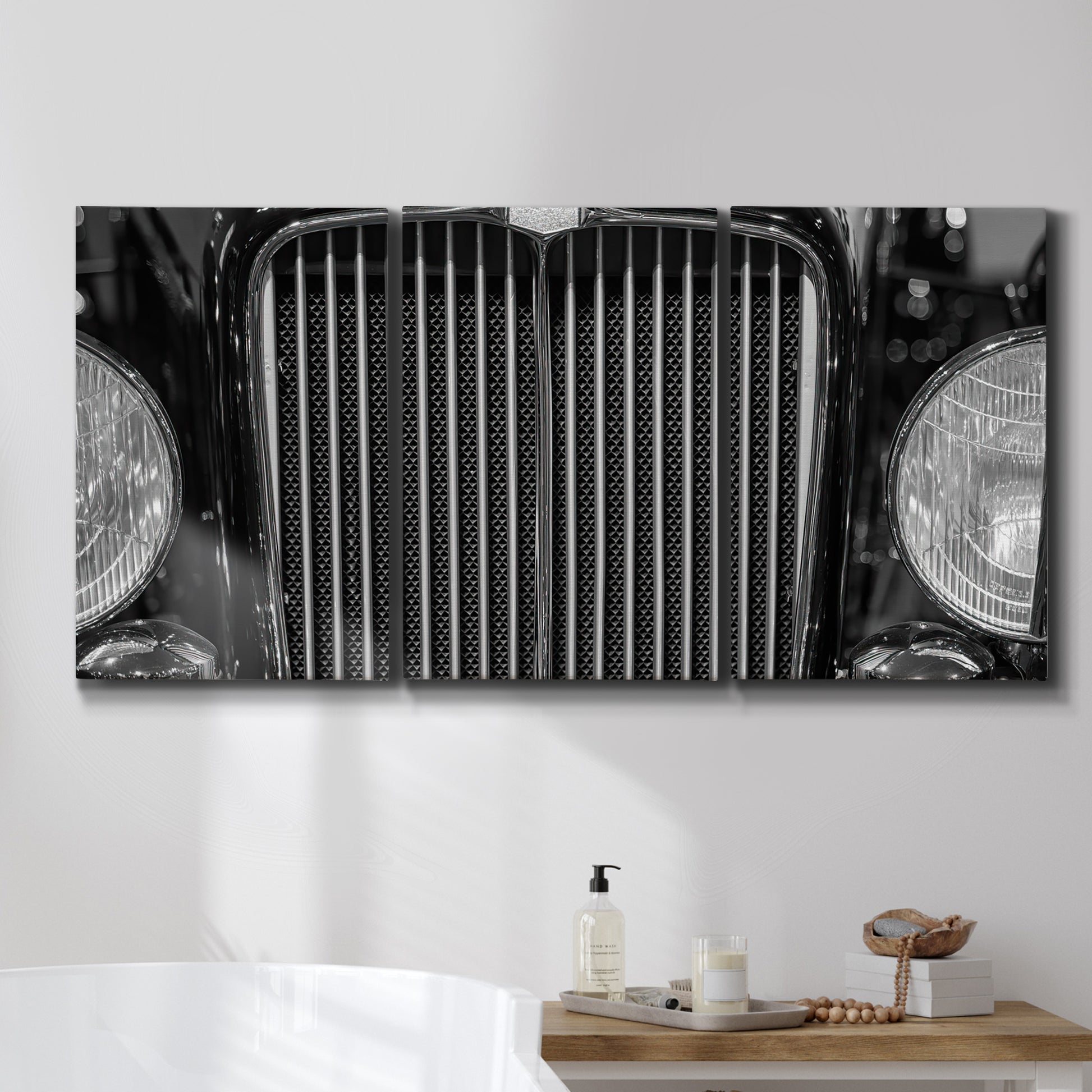 Three-panel canvas wall art featuring vintage car grille detail, displayed in a bathroom above a bathtub.