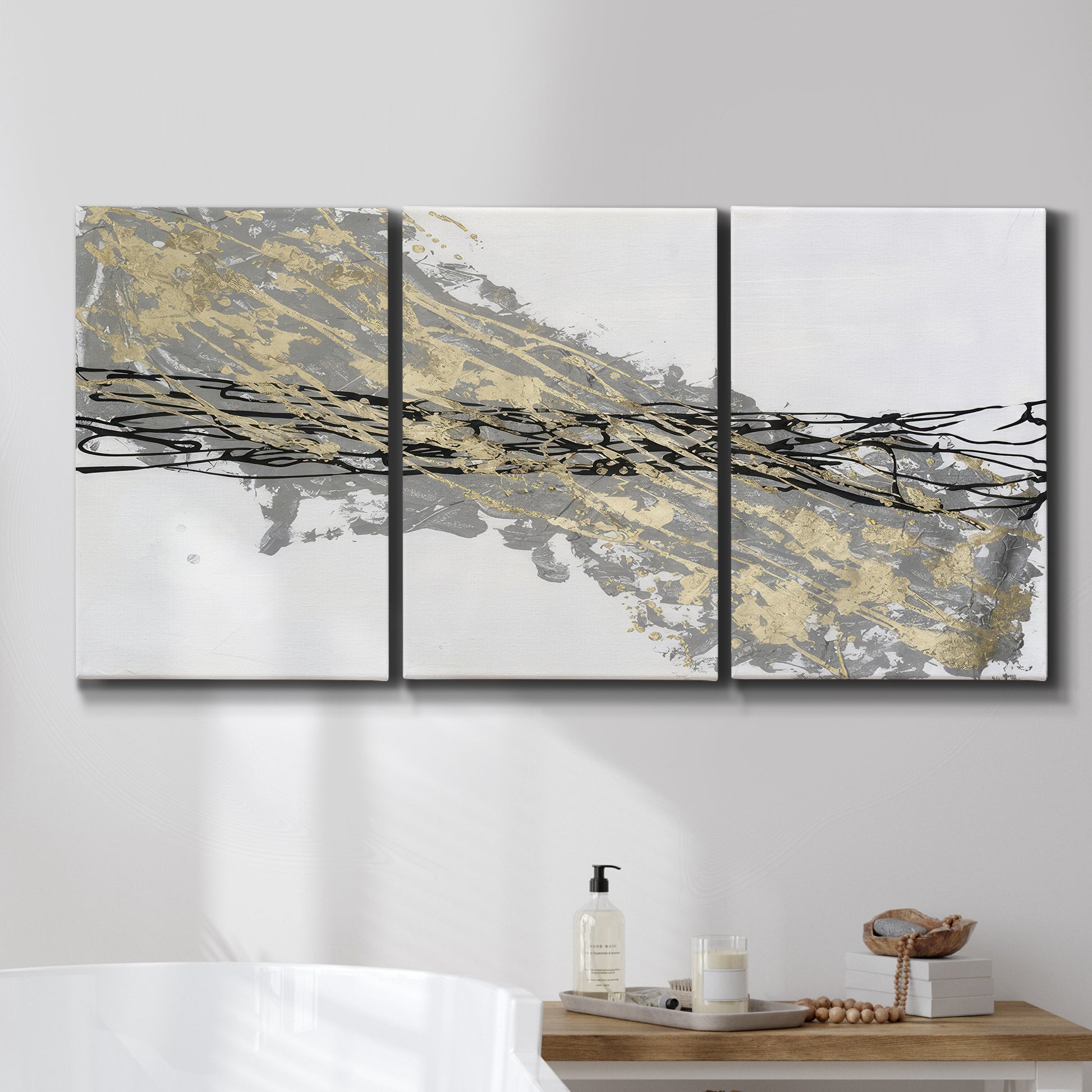 Three-panel canvas wall art featuring light modern abstract wind patterns, displayed in a bathroom above a bathtub.