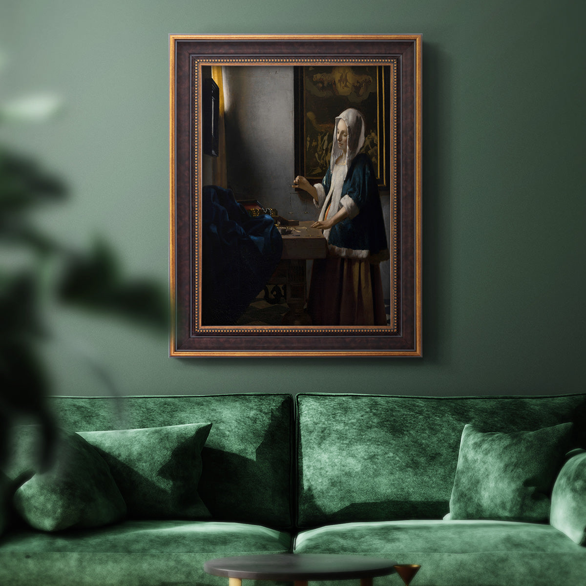 Quiet interior genre scene of a woman with scales by Johannes Vermeer in an ornate bronzed mahogany wood frame displayed in a dark-toned interior setting.