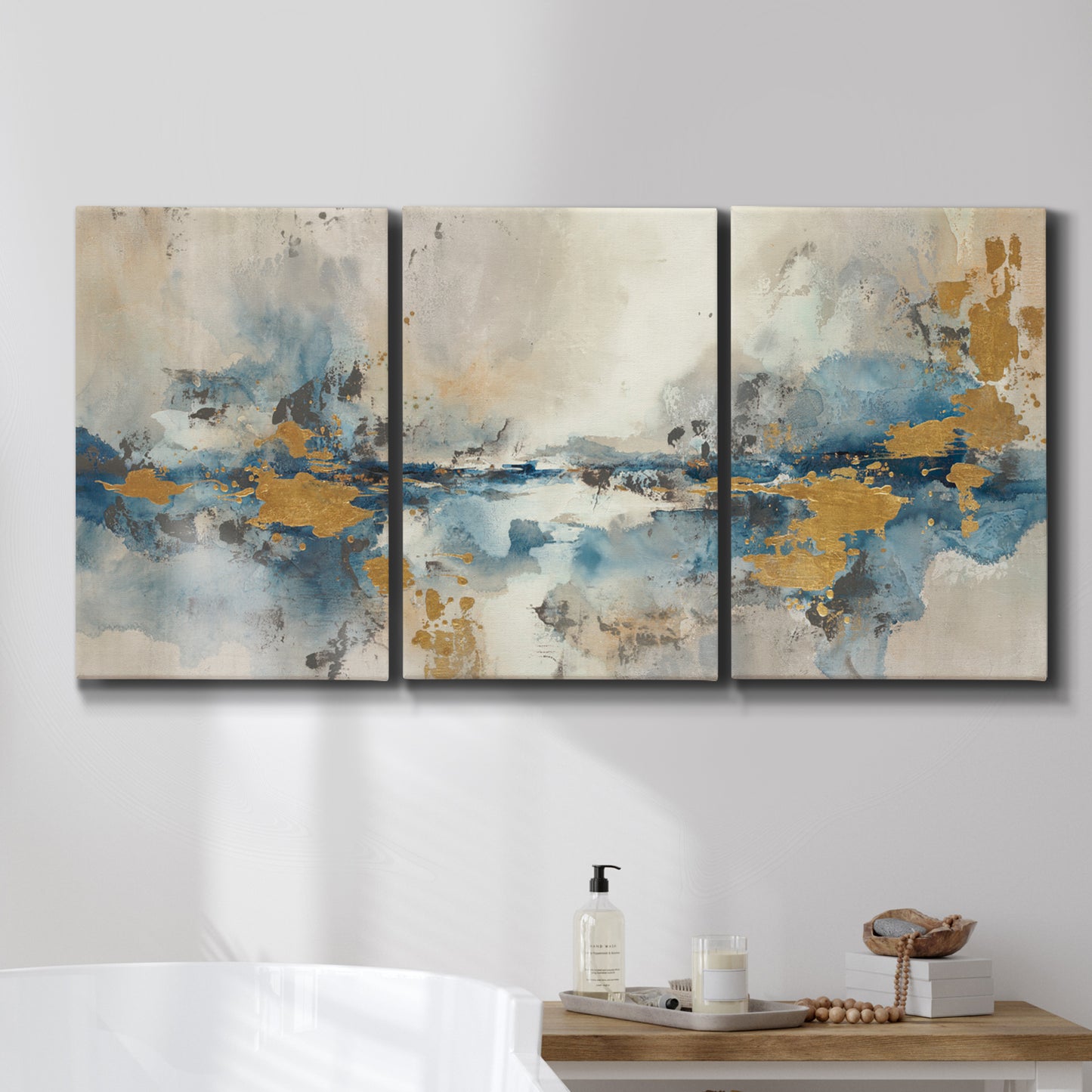 Three-panel canvas wall art featuring abstract soft morning light, displayed in a bathroom above a bathtub.