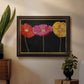 Contemporary poppy flower artwork in an ornate mahogany wood frame with gold liner displayed in a dark-toned interior setting.