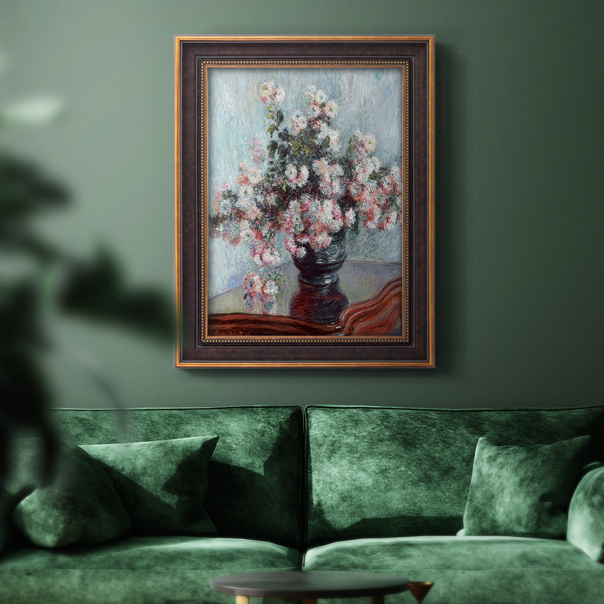 Impressionist chrysanthemum floral painting by Claude Monet in an ornate bronzed mahogany wood frame displayed in a dark-toned interior setting.