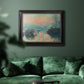 Impressionist winter river sunset scene by Claude Monet in an ornate black frame with gilded inner detail displayed in a dark-toned interior setting.