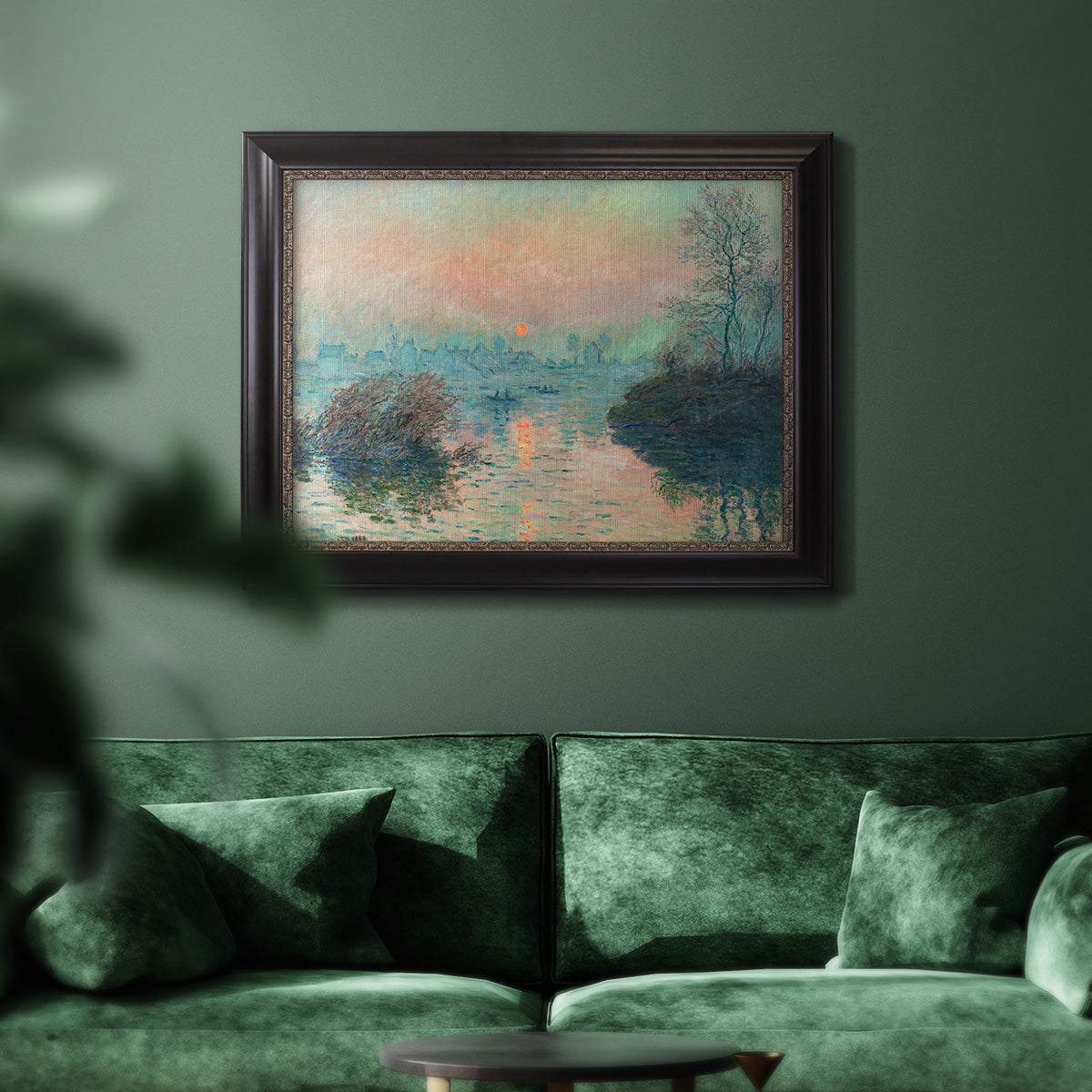 Impressionist winter river sunset scene by Claude Monet in an ornate black frame with gilded inner detail displayed in a dark-toned interior setting.