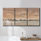 Three-panel canvas wall art featuring soft early evening landscape light, displayed in a bathroom above a bathtub.