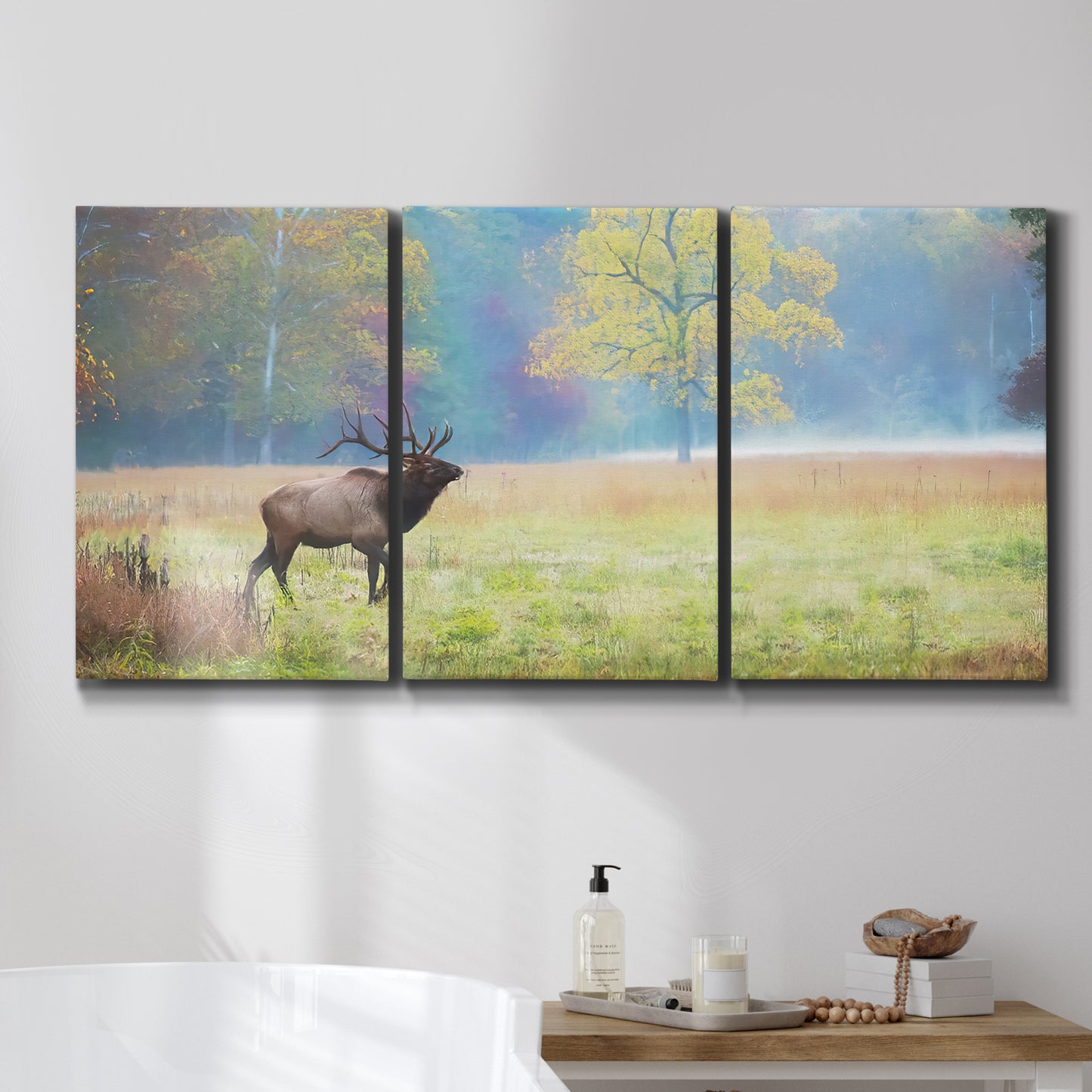 Three-panel canvas wall art featuring resting animals in open field, displayed in a bathroom above a bathtub.