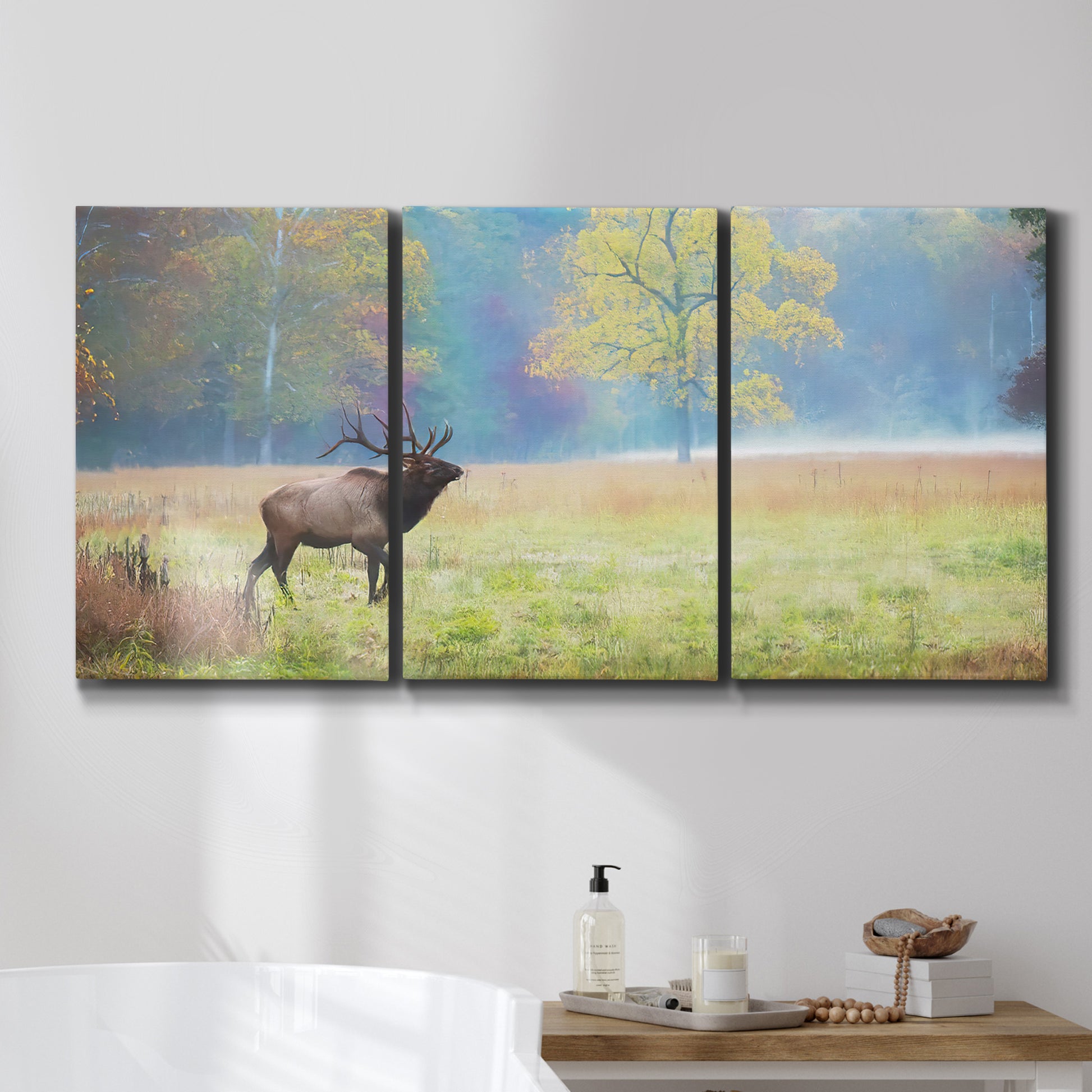 Three-panel canvas wall art featuring resting animals in open field, displayed in a bathroom above a bathtub.