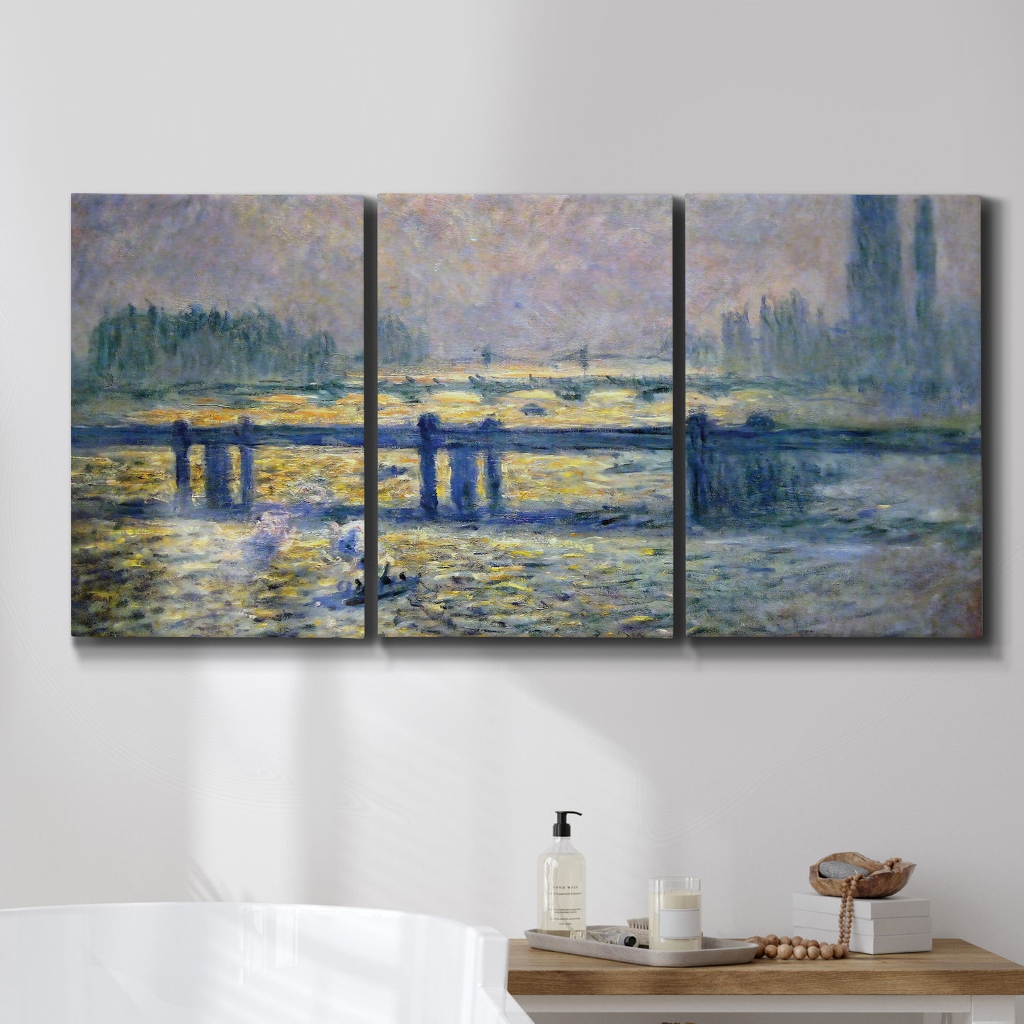 Three-panel canvas wall art featuring london bridge crossing wide river, displayed in a bathroom above a bathtub.