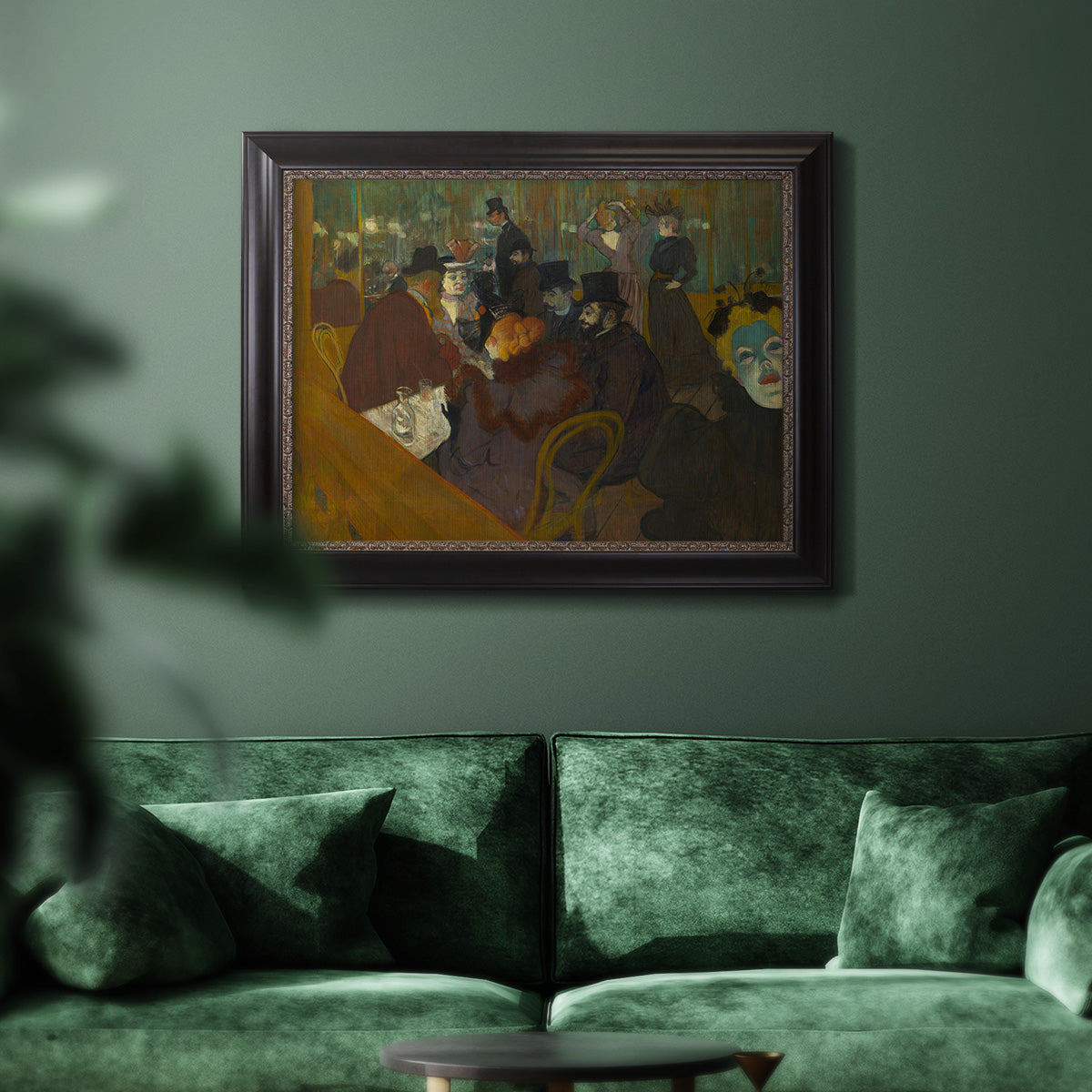 Impressionist cabaret interior scene by Henri de Toulouse-Lautrec in an ornate black frame with gilded inner detail displayed in a dark-toned interior setting.