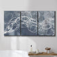 Three-panel canvas wall art featuring coastal shoreline at golden hour, displayed in a bathroom above a bathtub.