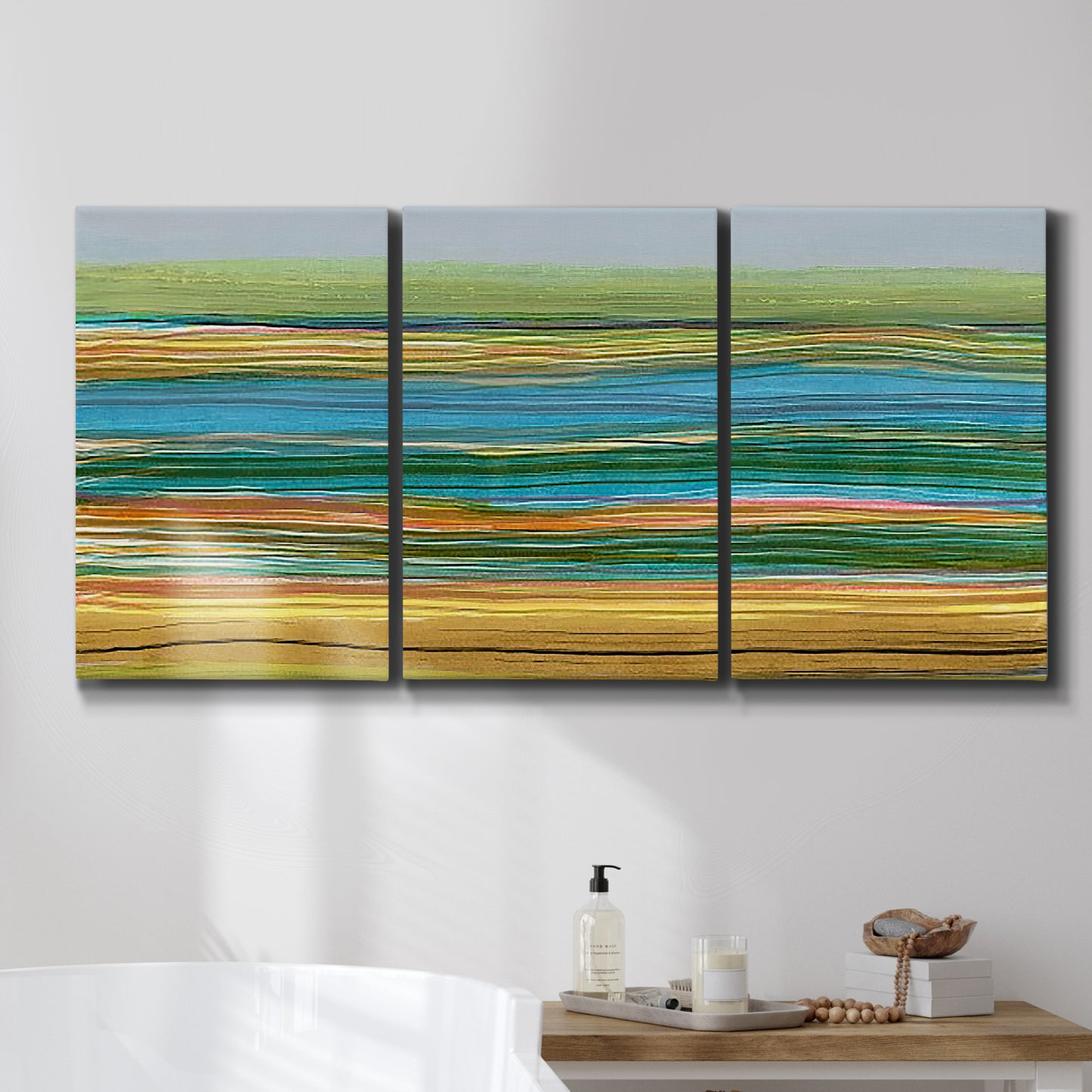 Three-panel canvas wall art featuring parallel linear abstract striations, displayed in a bathroom above a bathtub.