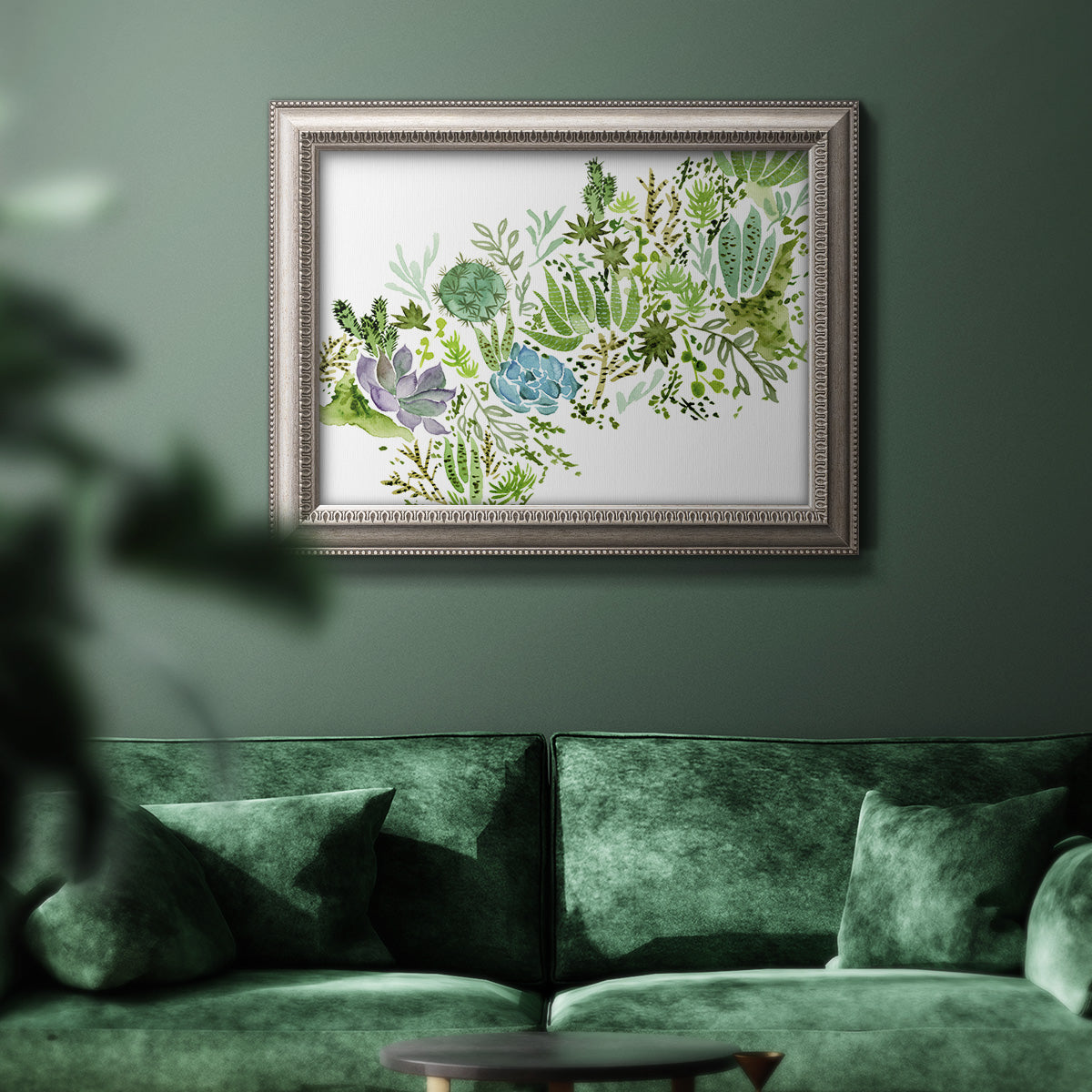Minimalist abstract succulent botanical watercolor artwork in an ornate vintage silver frame displayed in a dark-toned interior setting.