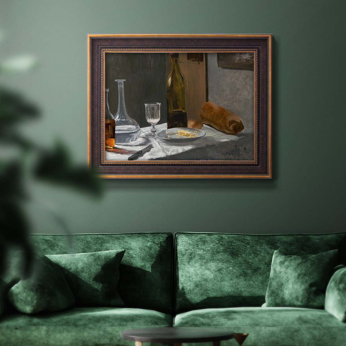 Impressionist still life with wine and bread by Claude Monet in an ornate bronzed mahogany wood frame displayed in a dark-toned interior setting.