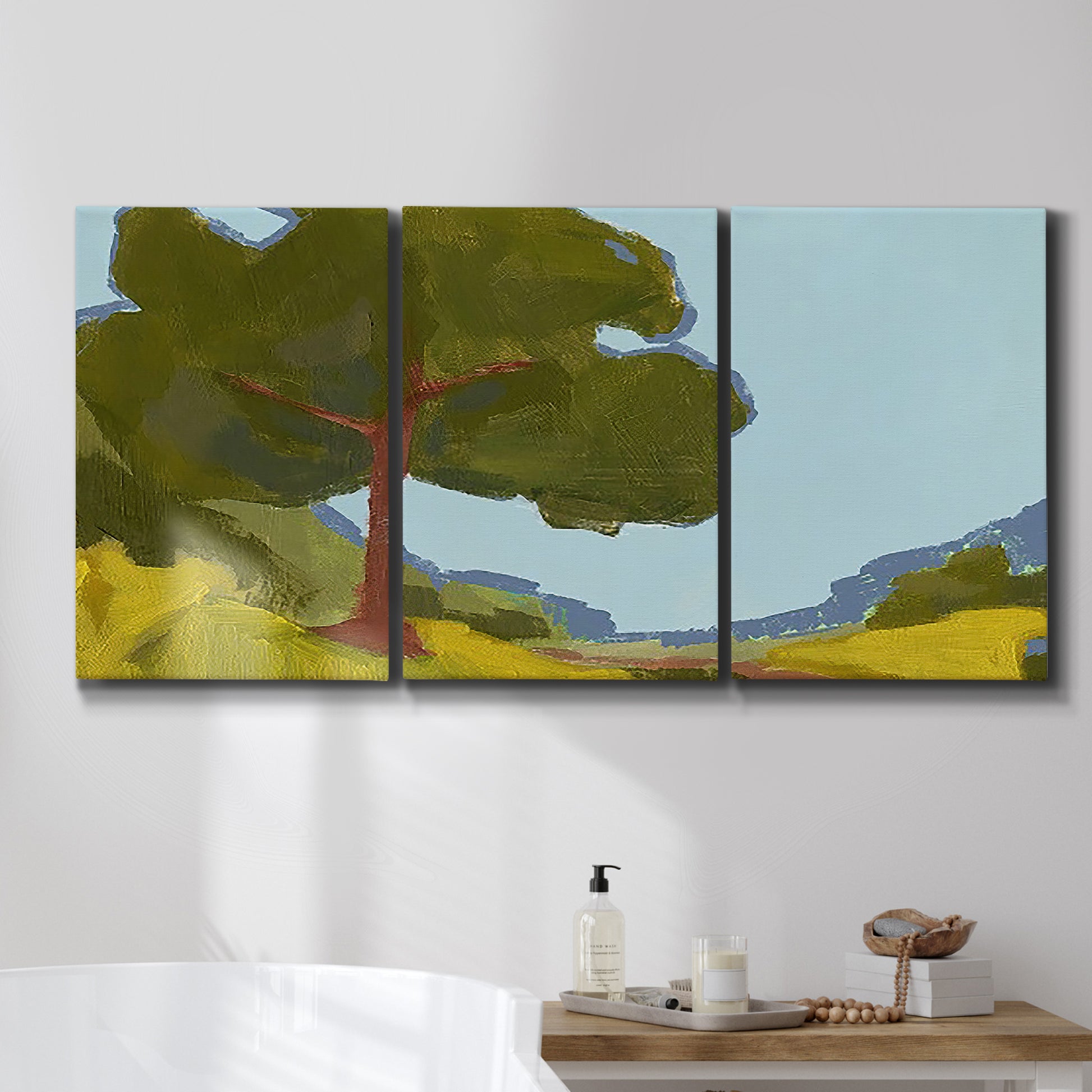 Three-panel canvas wall art featuring sunlit public park landscape view, displayed in a bathroom above a bathtub.