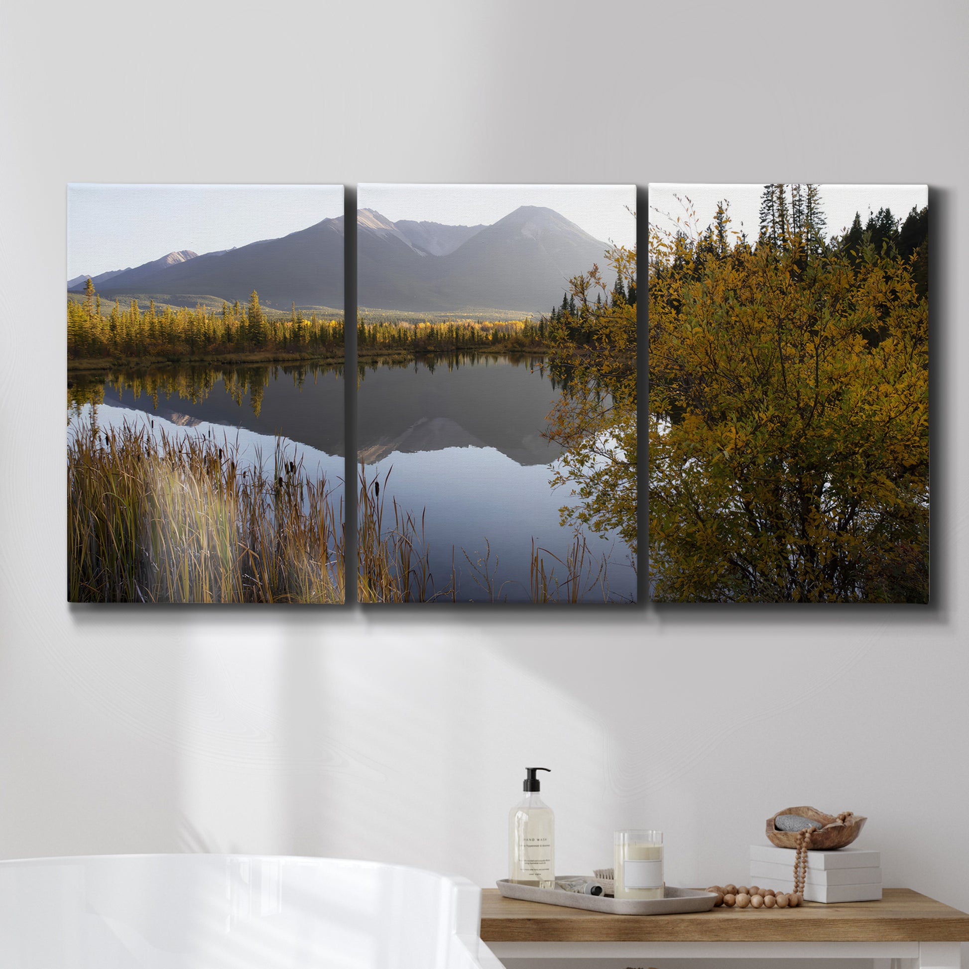 Three-panel canvas wall art featuring low light river photography, displayed in a bathroom above a bathtub.