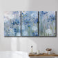 Three-panel canvas wall art featuring delicate watercolor floral blooms, displayed in a bathroom above a bathtub.