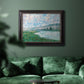 Impressionist river landscape at Vétheuil by Claude Monet in an ornate black frame with gilded inner detail displayed in a dark-toned interior setting.