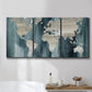 Three-panel canvas wall art featuring golden coastal sunset with cliffs, displayed in a bathroom above a bathtub.