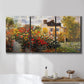 Three-panel canvas wall art featuring farm buildings in rural normandy, displayed in a bathroom above a bathtub.