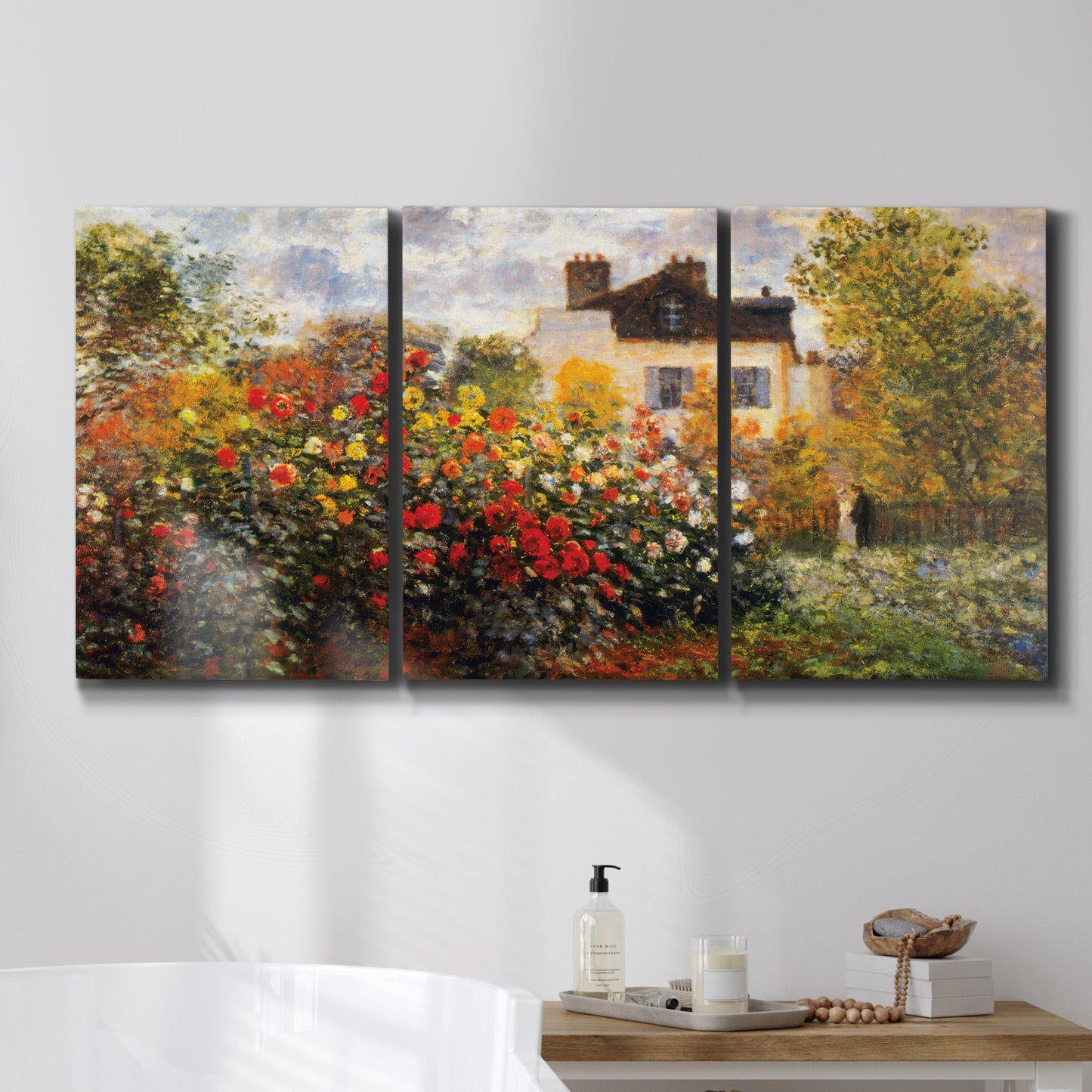 Three-panel canvas wall art featuring farm buildings in rural normandy, displayed in a bathroom above a bathtub.